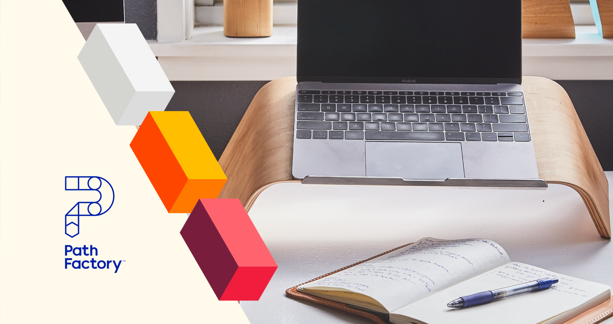 Decorative blocks on beige background. Image of an Apple laptop and notebook with pen. PathFactory logo on bottom left side