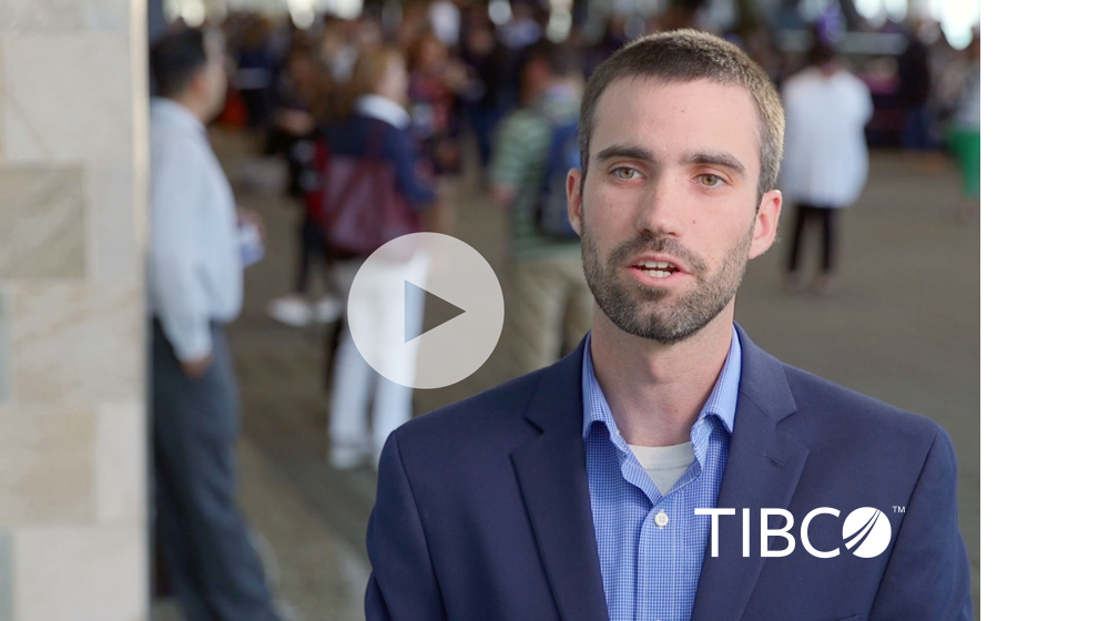 A still of a video featuring Tim Noble, Marketing Program Specialist at TIBCO Software with a play icon superimposed on top of the whole image.