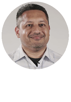 Circular Headshot of Mervyn Alamgir on top of the white Tibco logo