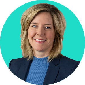 Headshot of Lisa Gately, Principal Analyst at Forrester, smiling with a green background.