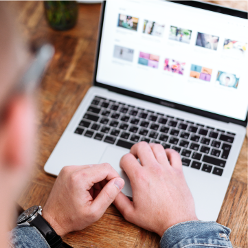 A customer self nurturing by consuming content on a laptop