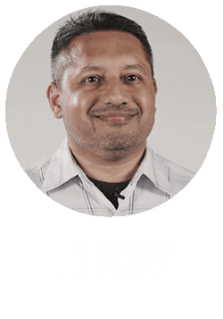 Circular Headshot of Mervyn Alamgir on top of the white Tibco logo